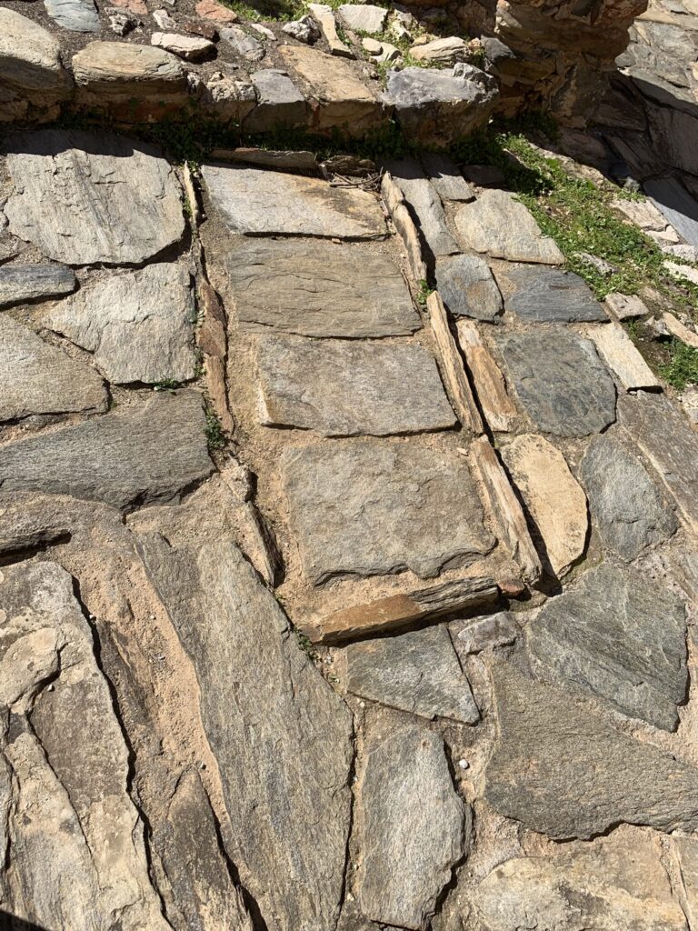 An ancient adult stone grave embedded in the interior floor of Panagia of Fodele Byzantine church.