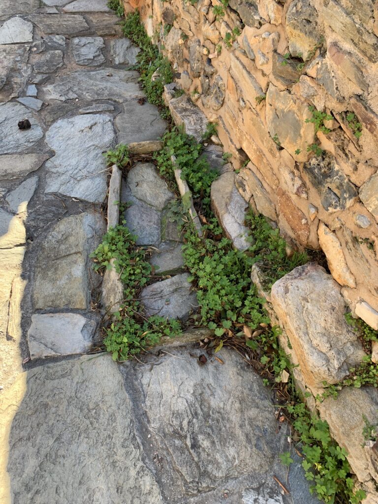 An ancient stone infant grave embedded in the floor of the Panagia of Fodele Byzantine church.